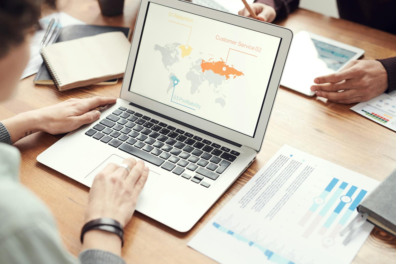 Person reviewing analytics charts on a laptop